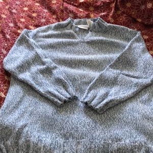 Long knit sweater in heathered blue and white.